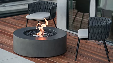 EcoSmart Fire Ark 40 fire table brings eco-friendly ethanol flame to Starfire outdoor patio, round concrete centrepiece.
