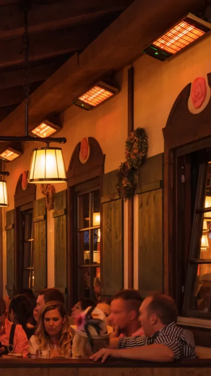 Heatscope Heaters Spot 2800W Radiant Heater wall-mounted in a commercial restaurant, electric infrared outdoor heating enhancing comfort.