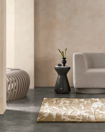 Blinde Design Solo Stool in natural concrete anchors private residence living room décor with minimalist modern seating appeal.