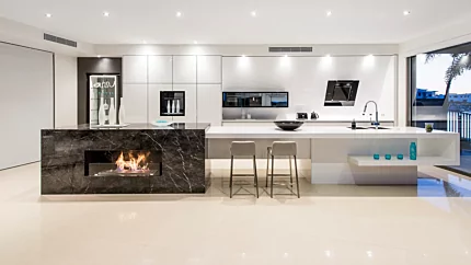 EcoSmart Fire XL900 Ethanol Burner integrated into Enigma Interiors kitchen island delivers ventless bioethanol flame centrepiece.