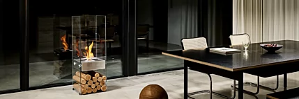 EcoSmart Fire Ghost Designer Fireplace brings modern ethanol heating to a private residence dining room in Japan with a sleek freestanding design.