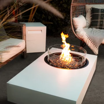 Tequila 50 Fire Table by EcoSmart Fire enhances the outdoor living space of a private home courtyard with modern ethanol fireplace ambience.